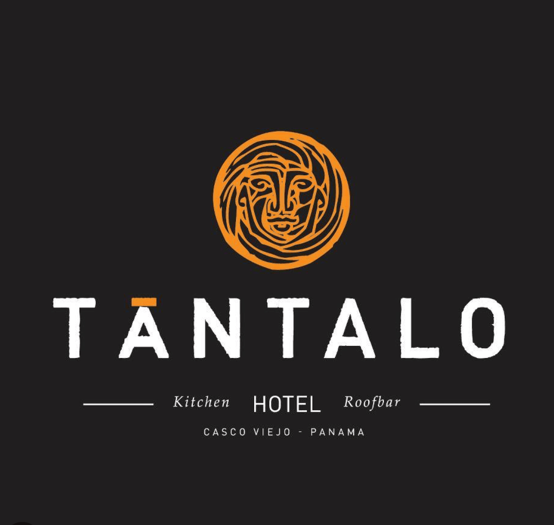 Tántalo logo on a black background, featuring a stylized face in orange above bold text reading Kitchen, Hotel, Roofbar – Casco Viejo, Panama.
